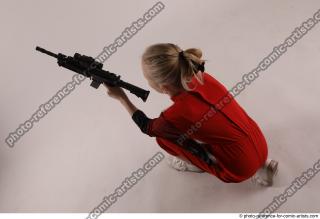 DENISA KNEELING POSE WITH GUN